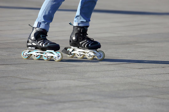 legs rolling around on roller skates