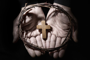 man with a cross and a crown of thorns