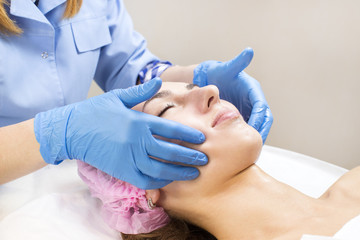 Process of massage and facials in beauty salon