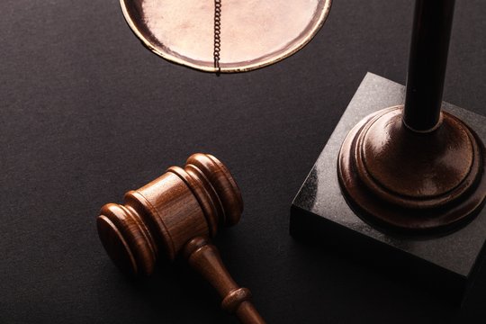 Law scales and wooden gavel.