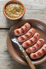 Grilled sausages with mustard sauce