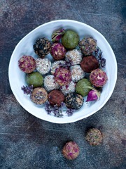 Various Raw vegan sweet candy gluten-free balls. Top view