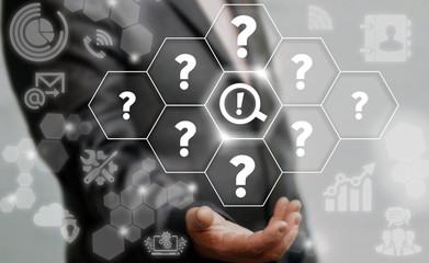 Risk Analysis, Management Business concept. FAQ - search information. Man offers magnifier exclamation mark icon on virtual screen on background of network questions. Question, answer technology