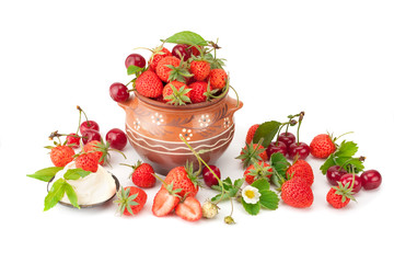 Strawberries with cream and ripe cherry.