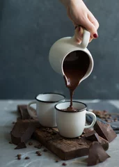 Zelfklevend Fotobehang  Pouring Hot chocolate © DragonFly