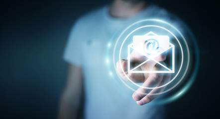 Businessman touching 3D rendering flying email icon with his finger