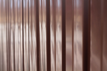 Obraz premium Background from metal profile sheet of chocolate color.
