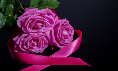 Pink roses isolated on black background. Mother's, Valentines, Women's, Wedding Day. Top view with copy space.  Place for text