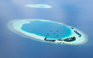 Aerial view from a seaplane of the Maldives atolls.
