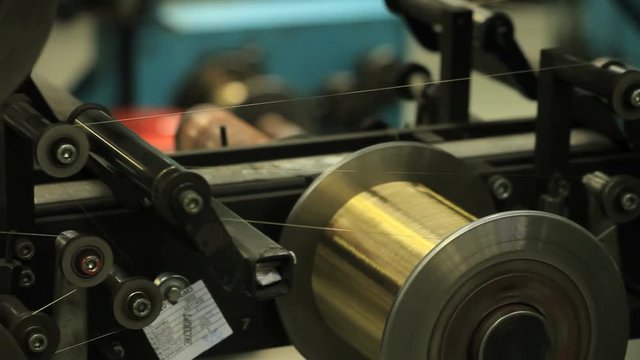 Copper wires production line. Metal cable manufacturing line. Industrial equipment on wire factory. Metal wire production process. Copper cable coil manufacturing process. Metal industry