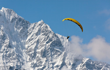 Paraglider flying against the mountain Lhotse (8516 m) - Everest region, Nepal, Himalayas - 141404015