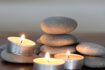 Fototapeta na wymiar stack of stones balance and candles