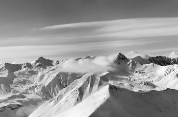 Black and white panorama of winter snow mountains