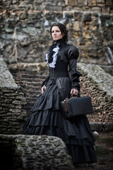 Outdoors portrait of a victorian lady in black