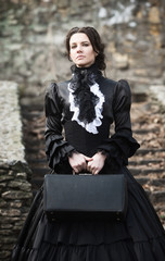 Outdoors portrait of a victorian lady in black