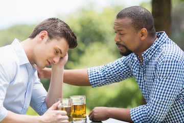 Friends having a conversation while having beer
