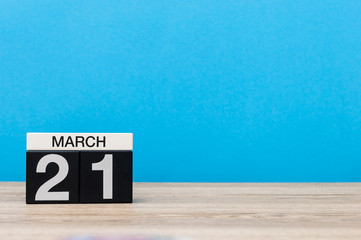 Fototapeta na wymiar March 21st. Day 21 of month, calendar on table with blue background. Spring time, empty space for text