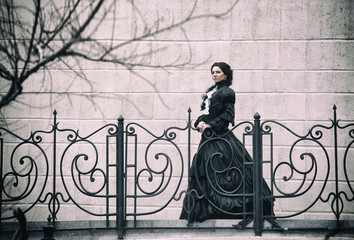 Outdoors portrait of a victorian lady in black