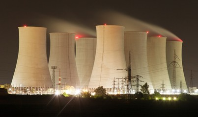 Night view of nuclear power plant and cooling towers