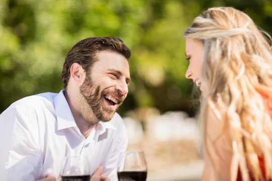 Couple laughing while sitting