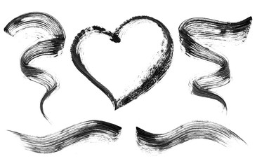 Set of black mascara strokes close-up, isolated on white background