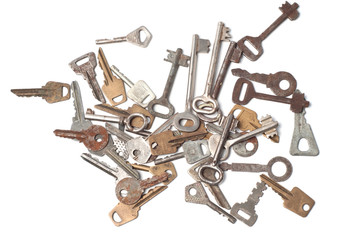 Old vintage keys of locks on a white background