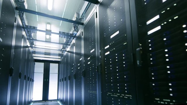 Camera Walkthrough Shot of a Working Data Center With Rows of Rack Servers. Shot on RED EPIC-W 8K Helium Cinema Camera.