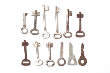 Old vintage keys of locks on a white background