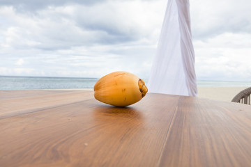 An exotic fruit on a dining table on a tropical beach