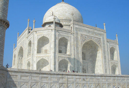 Close perspective angle of the Taj Mahal mausoleum in Agra, India, with the main building dome and the entry portal