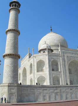 Dramatic Perspective of a minaret tower from the platform of the Taj Mahal mausoleum complex in Agra, India