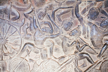 Stone Carving, all around on the wall at Angkor wat.