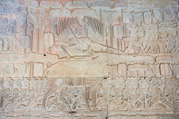 Fototapeta na wymiar Stone Carving, all around on the wall at Angkor wat.