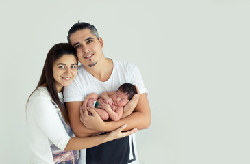 Fototapeta premium Father and mother handle baby