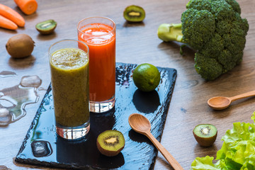 Detox diet. Healthy eating. Kiwi and carrot fresh juices.