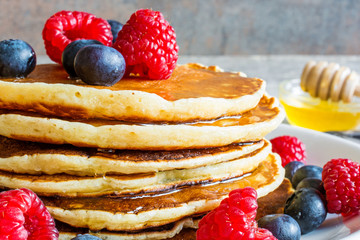 pancakes with berries and honey