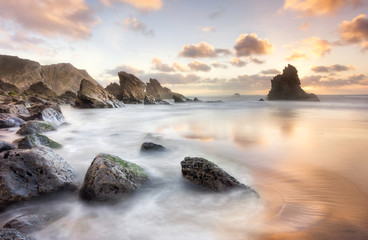 Golden moment and a beautiful sunset isolated beach 