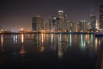 Fototapeta na wymiar Water flashing light of high-rise blocks