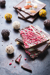 Stack of chocolate bars and praline truffle