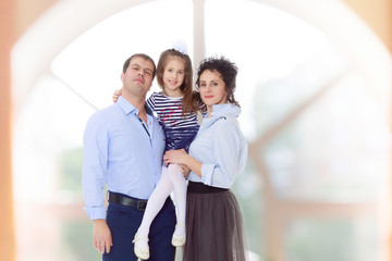 Happy parents with a small daughter.