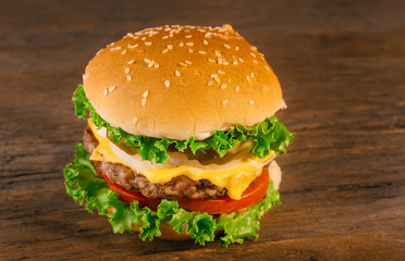 Appetizing homemade cheeseburger with beef patty tomato, cheese,