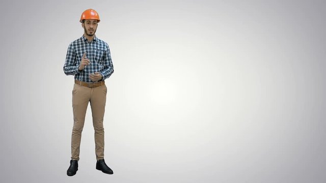 Construction worker enlisting factors for success on his fingers on white background.
