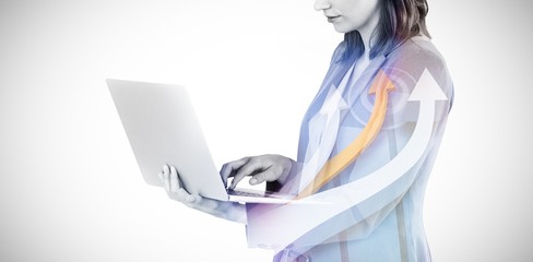Composite image of businesswoman typing on laptop computer 3d