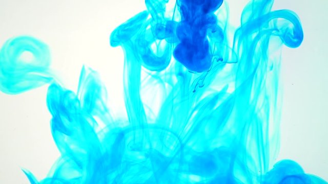 ink poured into water slow motion