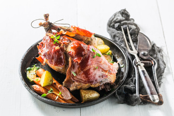 Fresh pheasant with bacon and vegetables and spices
