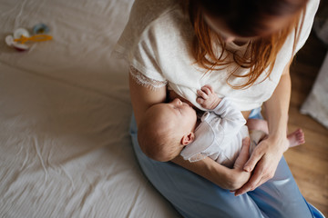 Mother breastfeeding her newborn baby