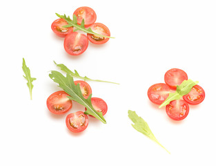 fresh vegetable, cherry tomato and green arugula isolated on white