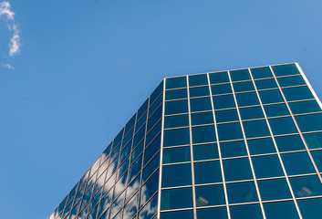 Urban Geometry, looking up to glass building. Modern architecture, glass and steel. . Abstract architectural design. Inspirational, artistic image.Minimal art. Architectural design. Building exterior.