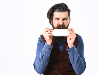 bearded man holding bottle of kefir with angry face