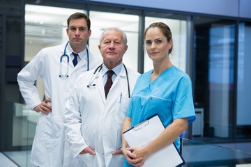 Doctors and surgeon standing together in hospital